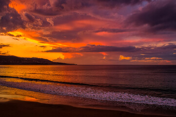 Naklejka na ściany i meble sunset on the Canteras beach in Las Palmas