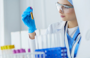 laboratory assistant woman analyzing a blood sample