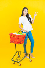 Portrait beautiful young asian woman smile with grocery basket
