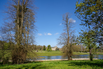 SWINDON, WILTSHIRE, UK -APRIL 25 : View of Lydiard Park showing a distant view of the Palladian house near Swindon Wiltshire on April 25, 2021. Unidentified people