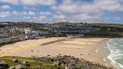 ST IVES, CORNWALL, UK - MAY 13 : View of Porthmeor beach at St Ives, Cornwall on May 13, 2021. Unidentified people