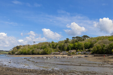 HELFORD, CORNWALL, UK - MAY 14 : View from Helford Creek at low tide in Helston, Cornwall on May 14, 2021. Two unidentified people