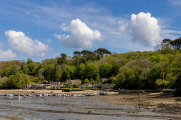 HELFORD, CORNWALL, UK - MAY 14 : View from Helford Creek at low tide in Helston, Cornwall on May 14, 2021. Two unidentified people