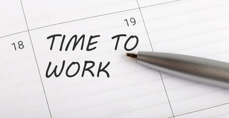 Text TIME TO WORK on calendar planner to remind you an important appointment with a pen on isolated white background.