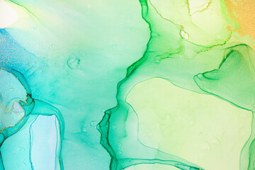 Fototapeta premium Watercolor green, blue and gold abstract stains background. Ink gradient texture.