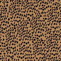 Animal skin cheetah seamless pattern, small black spots on brown background