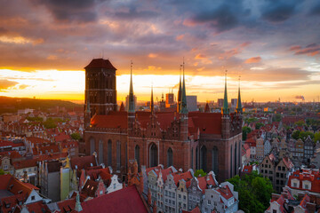 Amazing architecture of the main city in Gdansk at sunset, Poland. Aerial view of the St. Mary...