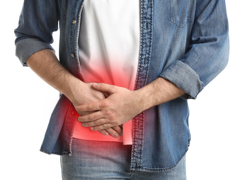 Man suffering from acute appendicitis on white background, closeup