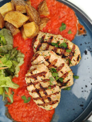 Greek traditional food with meat and vegetables in blue plate trendy cuisine modern background high quality print