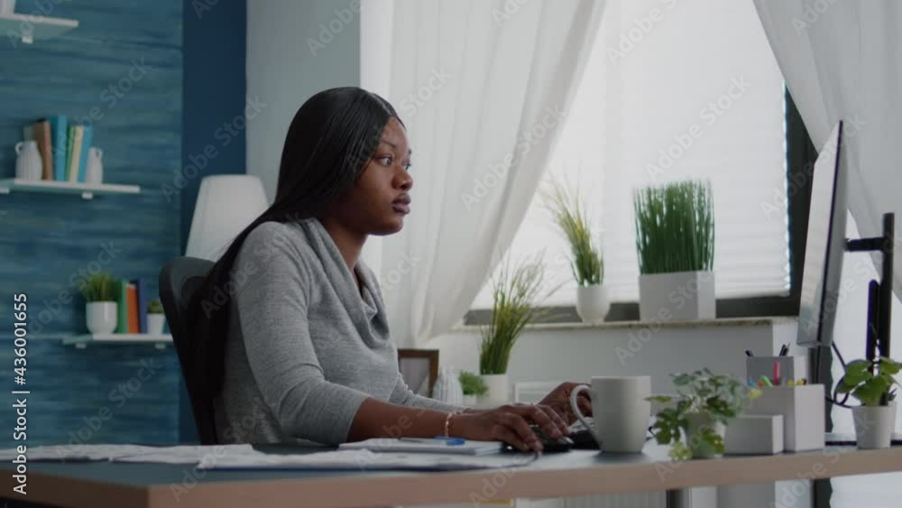 Poster student with black skin browsing high school university information using computer sitting at desk i