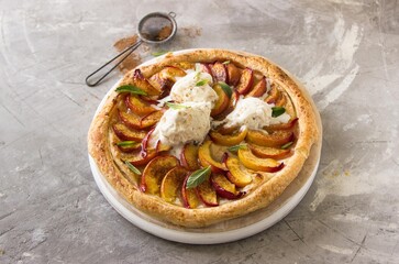 hot, homemade pie with peaches on a gray background. healthy food, comfort, holiday, vacations, dessert concept.