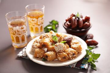 assorted of arabic food and mint tea