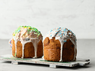 baked traditional Christian dessert for Easter holiday. The pastries are glazed and decorated with multi-colored sprinkles