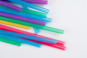 colorful plastic drinking straws isolated over the white background in high resolution