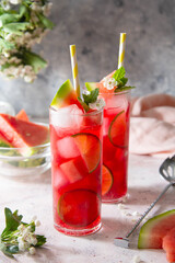 Watermelon refreshing lemonade with lime and mint. Delicious cocktail cold fruit drink.