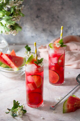 Watermelon refreshing lemonade with lime and mint. Delicious cocktail cold fruit drink.
