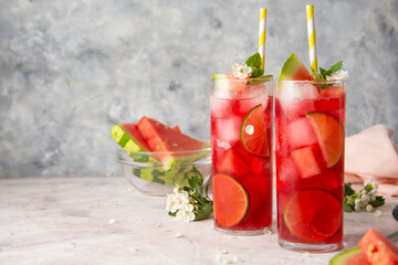 Watermelon soda lemonade with lime syrup and rum. Delicious cocktail cold fruit drink. Copy space.