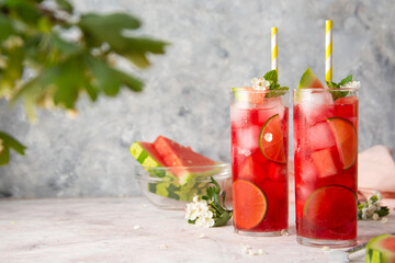 Watermelon soda lemonade with lime syrup and rum. Delicious cocktail cold fruit drink. Copy space.