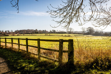 fence in the field with blue sky