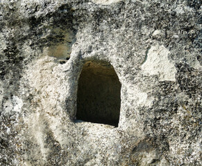 Entrance to a man-made cave in a limestone rock. A place of refuge for residents and monks