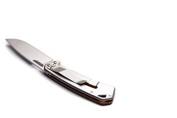 A small folding hunting knife isolated on the white background. Photo taken under soft artificial light.