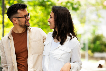 Fototapeta premium Happy young couple outdoors. Loving couple walking in the city