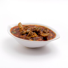 mutton curry or gravy in white bowl or murga musallam on white background