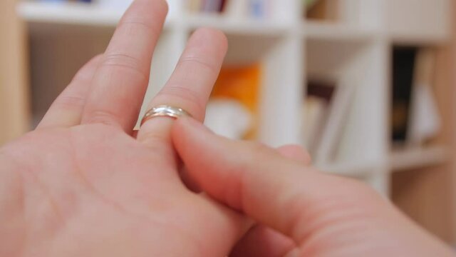 Wedding ring stuck man cant take off hands closeup