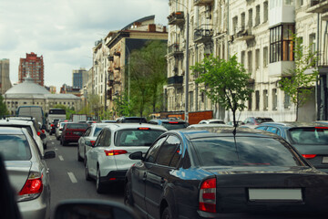 Fototapeta premium Cars in traffic jam on city street