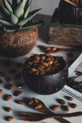 Coconut bowls containing almonds. Healthy food