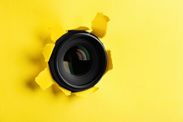 Hidden camera lens through hole in yellow paper