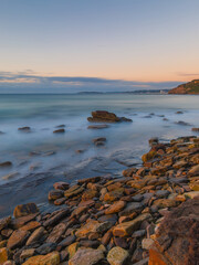 Clear view of dawn at the rocky beach.