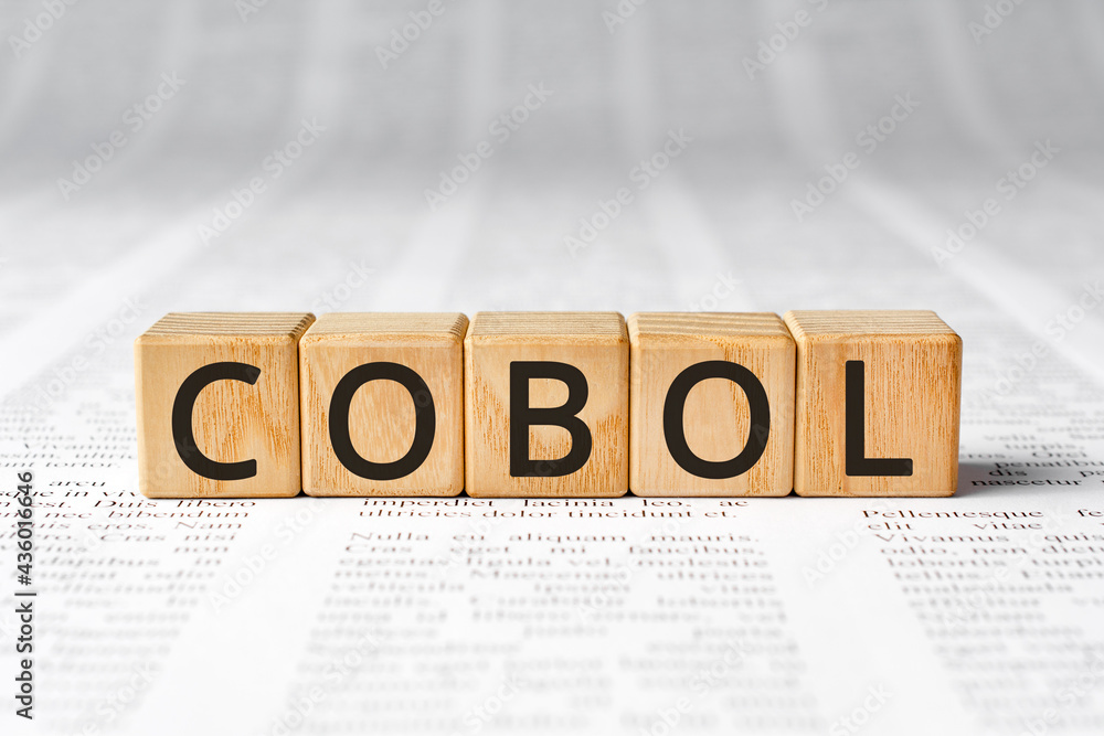 Poster cobol - word wooden blocks with letters, cobol common business oriented language concept, paper back