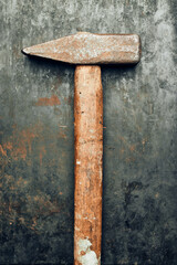 Old hammer on steel surface. Tool for maintenance. Hardware tool to fix. Technical background