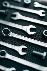 Set of chrome wrenches on steel surface. Mechanic tools for maintenance. Hardware tools to fix