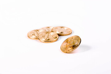 Golden Bitcoin Spinning In Front Of Bunch Of Bitcoins Isolated On White Background.