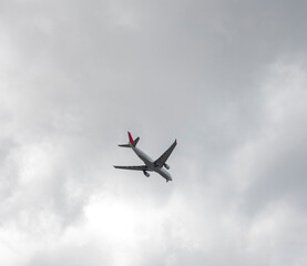 airplane in a cloudy sky