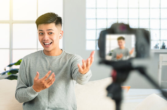 Young man recording video for an internet reportage or tutorial streaming