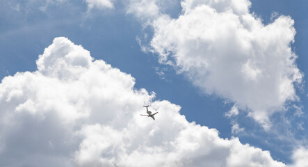 airplane in a cloudy sky