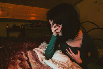 Obraz premium Sleepless nights of a yougn and stressed woman