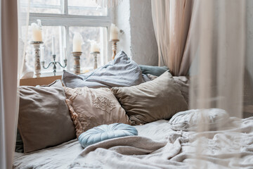 Big bed with baldachin and many pillows © brizmaker