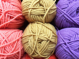 Balls of colored multicolored yarn. Close Up of yarn balls. knitting shop center. A lot of color yarn for knitting. Selection of colorful yarn wool on shopfront