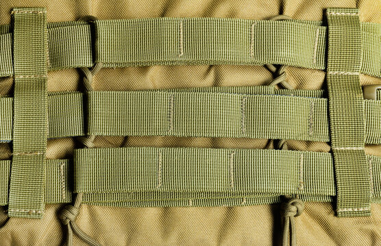 Photo of military olive colored armored vest molle system.