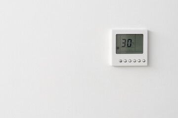 Automatic climate control on white wall at home