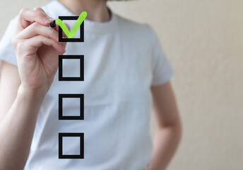 Checklist concept, woman checking mark on the check boxes with marker green