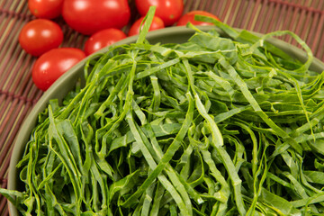 Raw cabbage leaf cut and ready to sauté