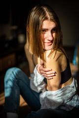 Beauty portrait of a beautiful young girl with a shadow pattern on the face and body in the form of...