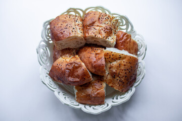 isolated photo of a traditional Turkish bread known as pide sliced and put in a white breadbasket