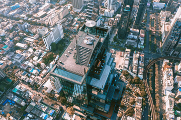 Fototapeta na wymiar Aerial view of Sathorn district during covid lockdown quarantine, Chong Nonsi, King Power Mahanakhon tower and skywalk in Bangkok, Thailand