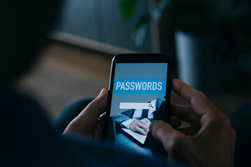 man uses a password manager app in his smartphone